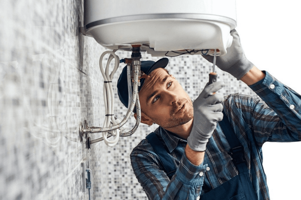 Plumber fixing a sink